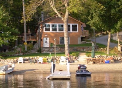 Waterfront lake house with private beach on Paradox Lake
