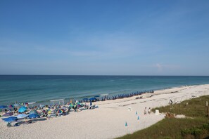 A beach with umbrellas and lounge chairs, a clear sky, and the ocean. - Ultimate Beach Getaway with Huge Pool, Shops, & Dining. Close to Rosemary & Alys (Rosemary Beach)