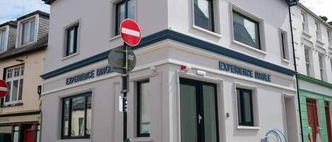 A building with a sign reading 'EXPERIENCE DING.'