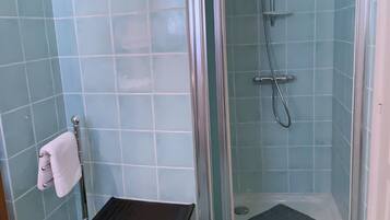 Shower, towels, soap, toilet paper