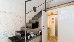 A modern staircase with a minimalist design, a flat surface for placing items, and a door leading to another room. - Suite 'Luxury Rooms - Erika' with Wi-Fi and Air Conditioning (Alezio)