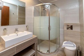 Deluxe Room, Balcony, Pool View | Bathroom | Slippers - Green Bay Thassos (Limenaria)