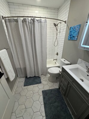 Hair dryer, towels, soap, toilet paper