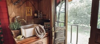 Bohemian caravan in the heart of nature with horses and donkeys