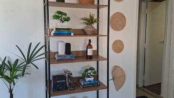 A bookshelf with various decorative items and books.