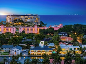 A coastal hotel with multiple buildings, a swimming pool, and a view of the ocean. - Casa del Rio - 2BR on the Intracoastal (Boca Raton)