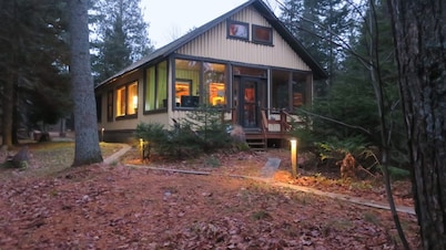 1922 rustic log cabin compound on Waiska Bay w/200 ft beach + 30 acres of trails