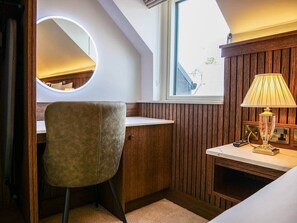 A small, cozy room with a desk, chair, and a lamp. - Experience Dingle @ Main Street - Room 5 (Dingle)