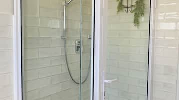Shower, towels, soap, toilet paper