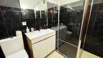 Shower, hair dryer, towels, soap