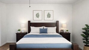 A bedroom with a wooden bed, bedside lamps, a ceiling fan, and two framed leaf artworks on the wall. - 3 Bedroom Backyard Oasis Near FIFA World Cup Events (Blue Springs)