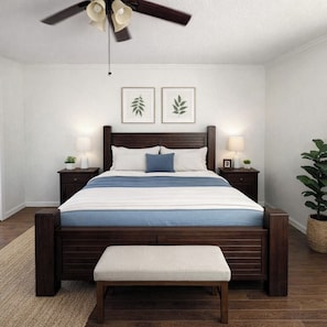 A bedroom with a wooden bed, bedside lamps, a ceiling fan, and two framed leaf artworks on the wall. - 3 Bedroom Backyard Oasis Near FIFA World Cup Events (Blue Springs)
