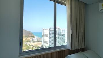 Family Condo, Sea View | Premium bedding, down duvets, in-room safe, iron/ironing board