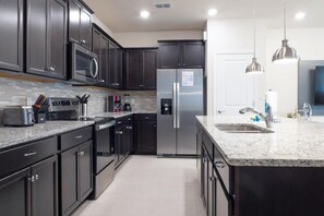 Townhome, Multiple Beds, Kitchen, Pool View (706GL-SVH) | Private kitchen - Spacious Townhouse w/ Pool & Free Parking Near Disney (Davenport)