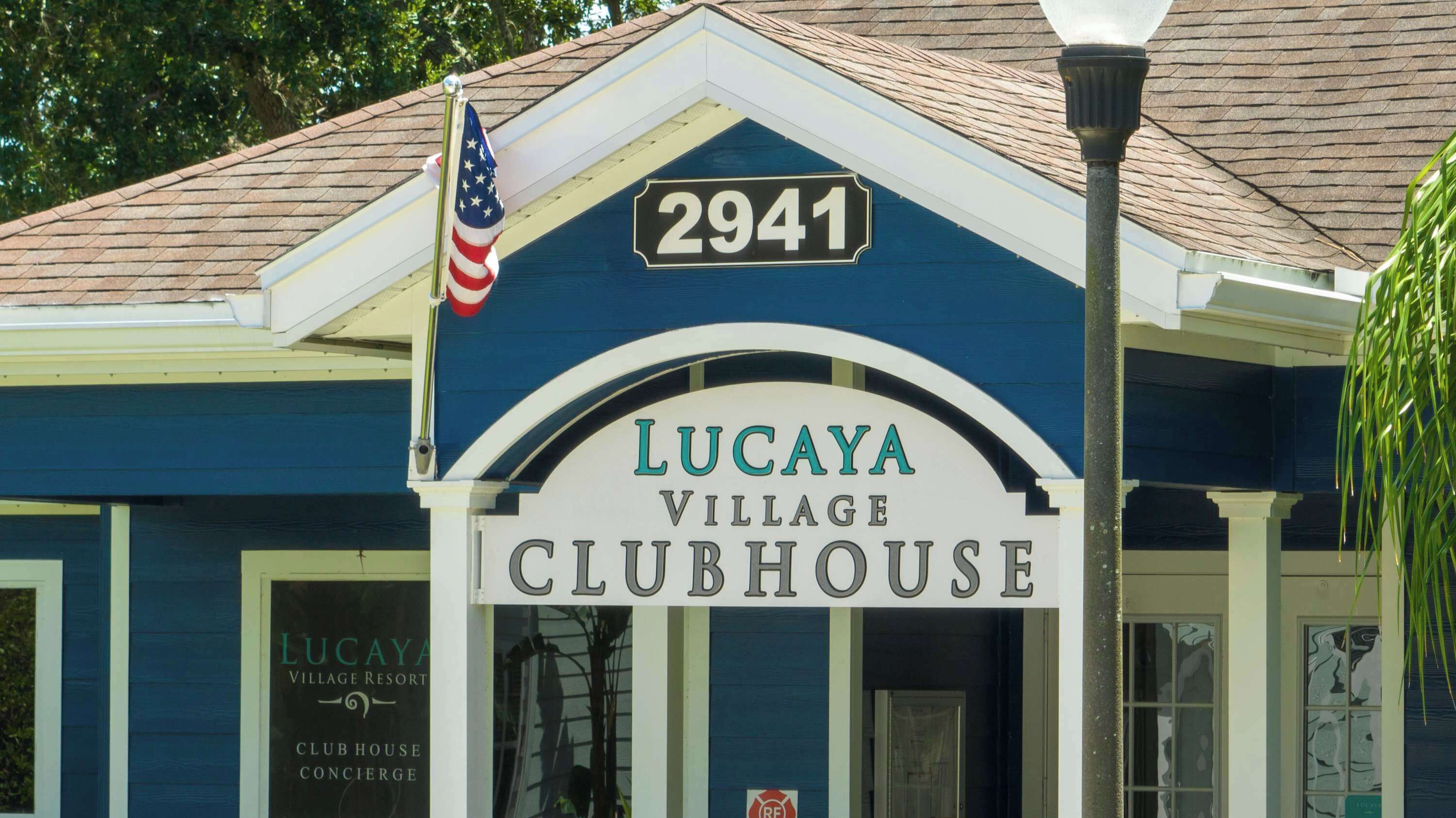 A building with a sign reading 'Lucaya Village Clubhouse' and the number '2941' above it.
