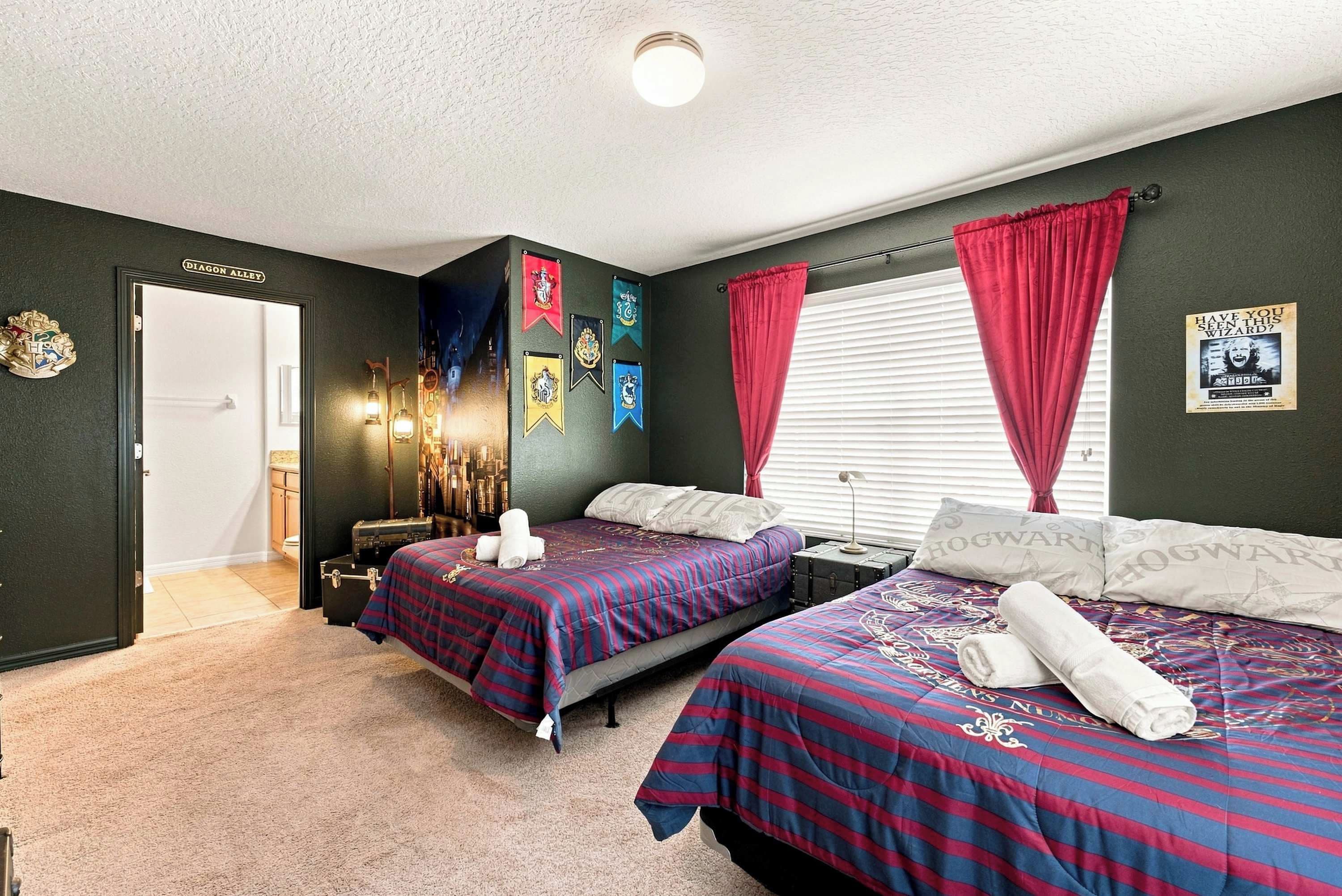 A bedroom with two beds, a wardrobe, a mirror, and a door labeled 'DIAGON ALLEY'.