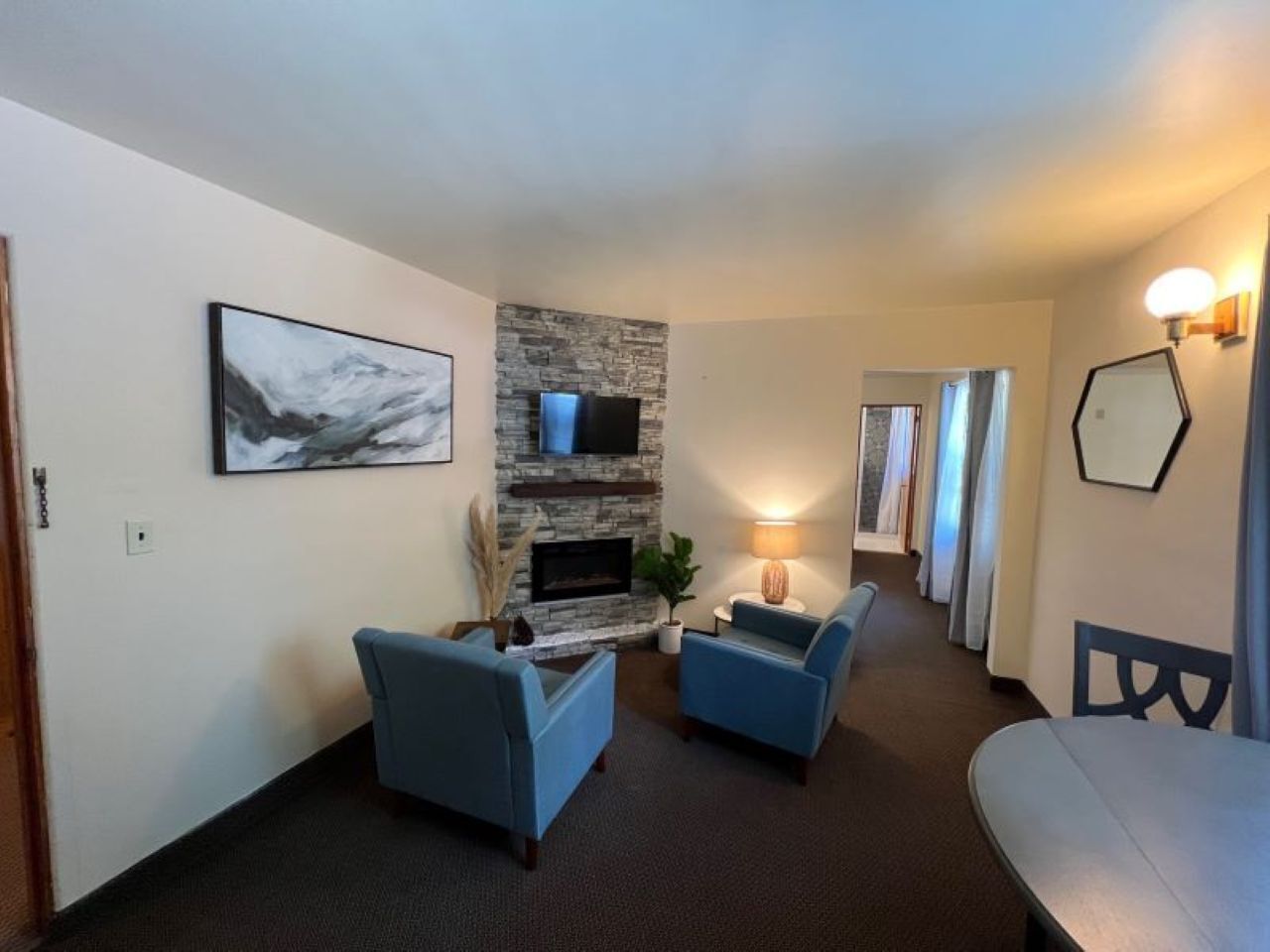 Deluxe Quadruple Room, 2 Double Beds | Living area | Fireplace