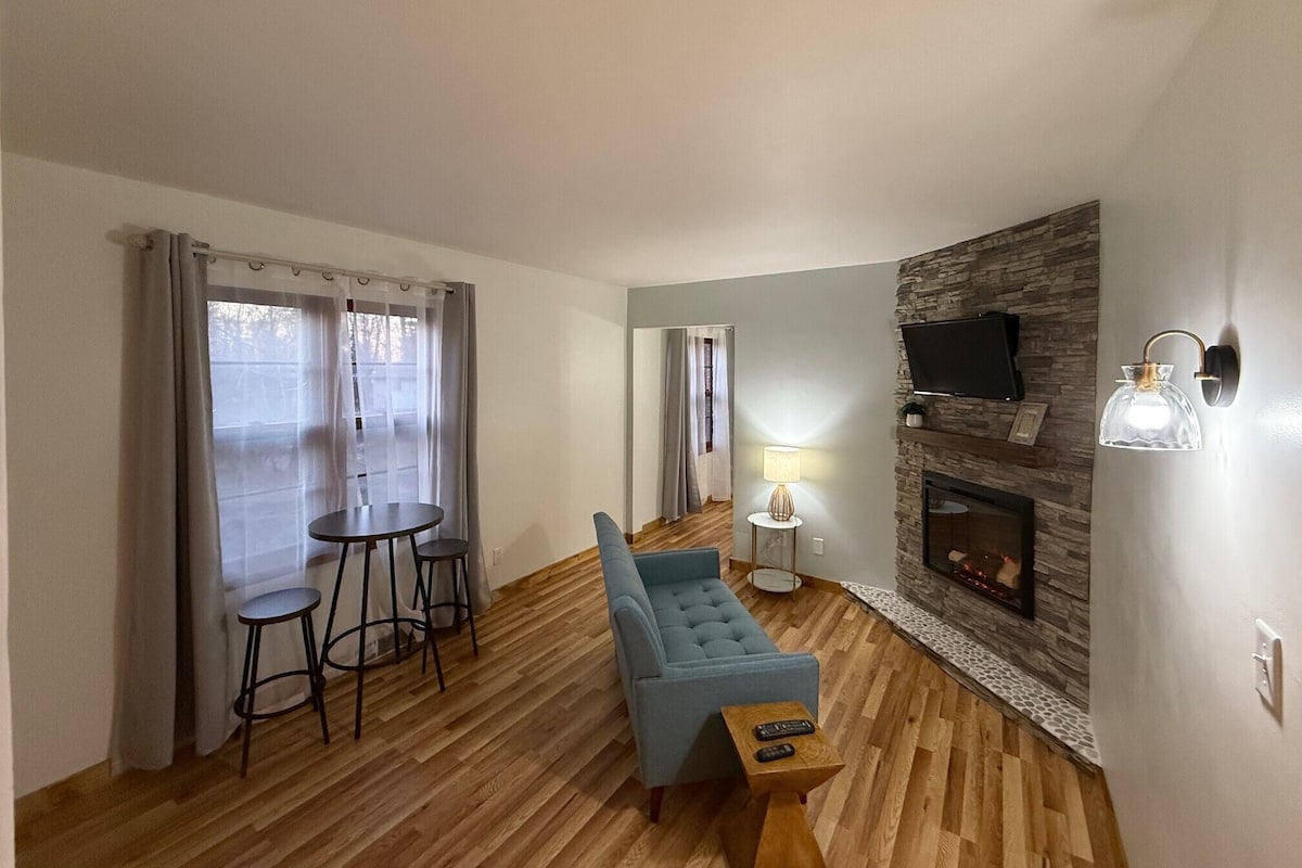 Deluxe Quadruple Room, 2 Double Beds | Living area | Fireplace