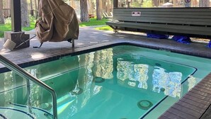 A swimming pool with a wooden deck, a covered grill, and a no-smoking sign. - Condo Near Eagle Lodge & Golf w/ Fireplace, WiFi & Shared Pool/Hot Tub/Sauna (Mammoth Lakes)