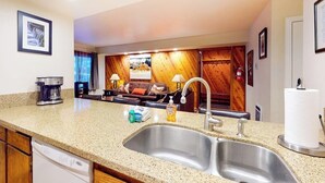 A kitchen with a double sink, a coffee maker, and a dish soap dispenser. - Updated Ground-floor Condo with On-site Pool, Hot Tub, Sauna, & Tennis Courts (Mammoth Lakes)