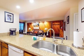 A kitchen with a double sink, a coffee maker, and a dish soap dispenser. - Updated Ground-floor Condo with On-site Pool, Hot Tub, Sauna, & Tennis Courts (Mammoth Lakes)
