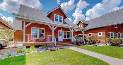 Adorable, two-story home with a furnished front porch, fireplace, & washer/dryer