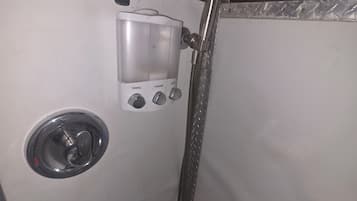 Shower, towels, soap, toilet paper