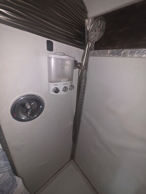 Shower, towels, soap, toilet paper