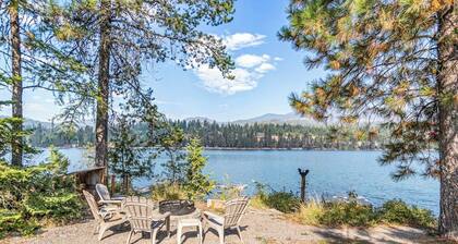 Riverfront ranch with large deck, fire pit, dock, W/D, & mountain view