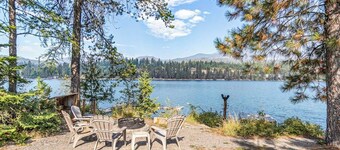 Riverfront ranch with large deck, fire pit, dock, W/D, & mountain view