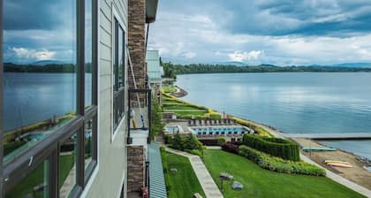 Lake view condo with WiFi, balcony, fireplace, & shared pool/hot tub/grills