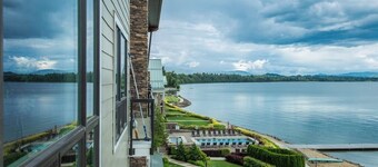 Lake view condo with WiFi, balcony, fireplace, & shared pool/hot tub/grills