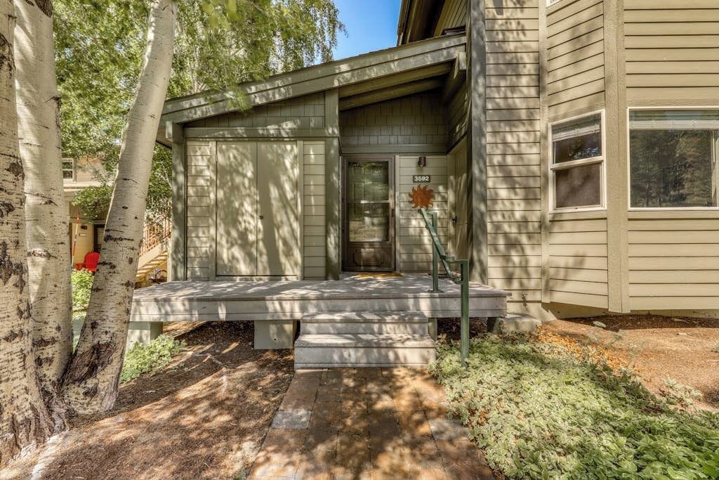 A house with a front porch, a mailbox, and a number 3582 on the door.
