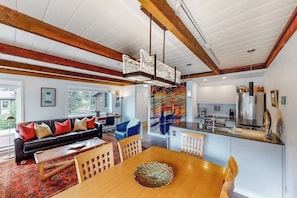 A modern interior with a dining area, kitchen, and living space. - Thoughtfully renovated condo with Sun Valley pass to pool & tennis (Sun Valley)