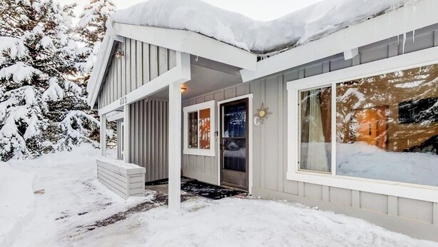 A house with a covered porch, a door, and a window. - Newly updated condo - close to downtown Ketchum & the ski lifts (Ketchum)