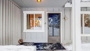 A house with a front door, a window, and a light fixture. - Newly updated condo - close to downtown Ketchum & the ski lifts (Ketchum)