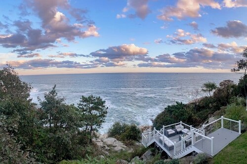 Modern oceanfront home with scenic deck, grill, games, chef's kitchen, & W/D