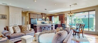 Centrally located open concept apartment with parking, central AC, & W/D