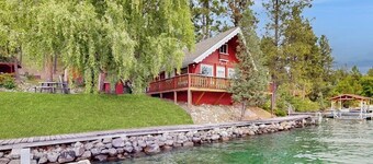 Cozy lakefront log cabin with lake views, vintage decor, & dock
