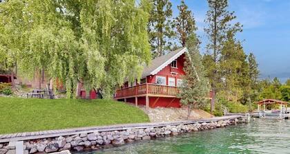 Cozy lakefront log cabin with lake views, vintage decor, & dock