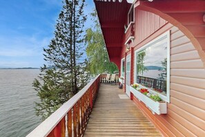 Terrace/patio - Cozy lakefront log cabin with lake views, vintage decor, & dock (Rollins)