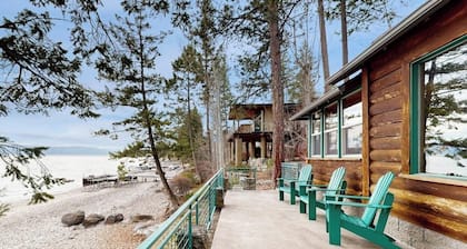 Lakefront home with amazing mountain views, wraparound deck, fireplace, & grill