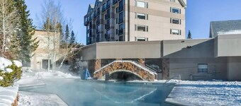 Cozy & charming ski-in/out mountain retreat with a pool, hot tub, & fitness room