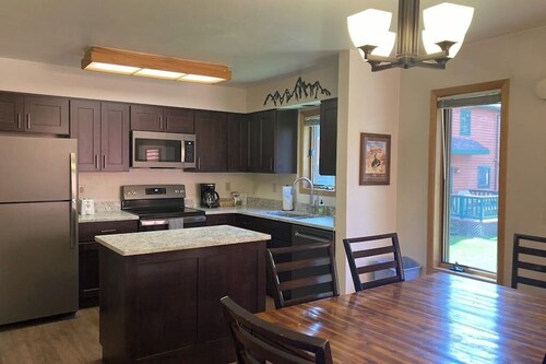 Roomy 2-story home with furnished deck, grill, fireplace, & great location