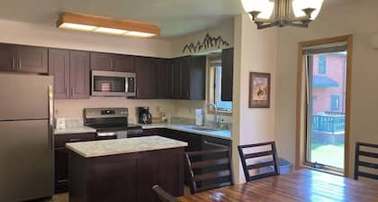 Roomy 2-story home with furnished deck, grill, fireplace, & great location