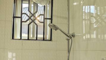 Shower, towels, soap, toilet paper