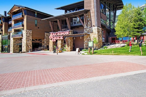 A multi-story building with a prominent sign reading 'Jackson Hole.' - Timber Ridge 4 condo with private sauna, walk to the Teton Village lifts (Teton Village)