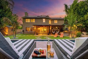 A two-story house with a patio area, a pool, and a dining setup. - **NEW**Backyard Dream - 5BR l Pool l Spa (Vista)