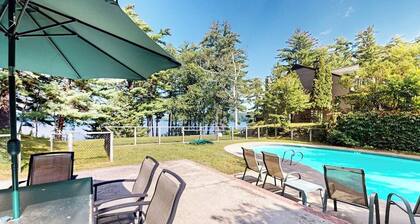 Lakefront condo with on-site pool, dock, swimming, firepit, & tennis