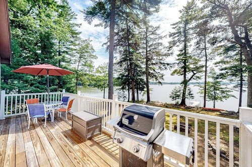 Two-story lakefront home with a seasonal dock, furnished deck, & washer/dryer